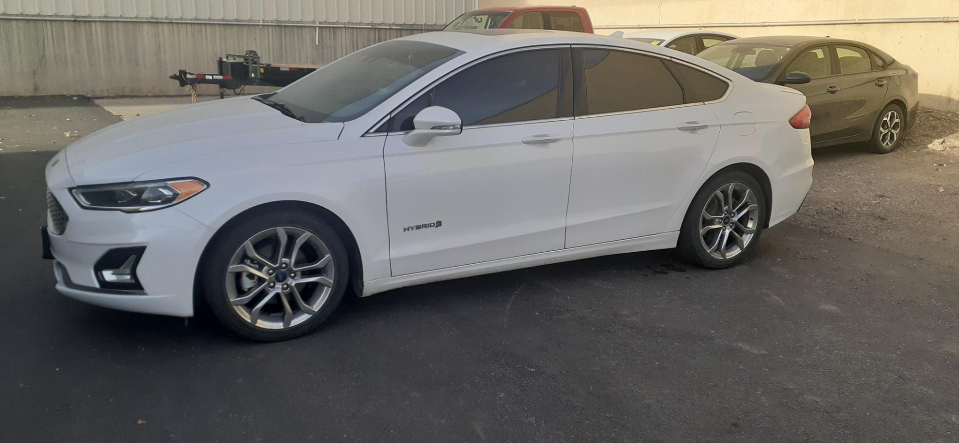 2019 Ford Fusion Hybrid Titanium (3FA6P0RU3KR) with an 2.0L L4 DOHC 16V HYBRID engine, CVT transmission, located at 2015 Cambell Street, Rapid City, SD, 57701, (605) 342-8326, 44.066433, -103.191772 - CARFAX AVAILABLE - Photo#0